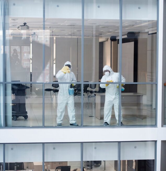 full-shot-people-hazmat-suit-cleaning-office_23-2149345584
